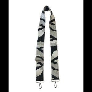 silver camo adjustable strap with silver metal hardware.